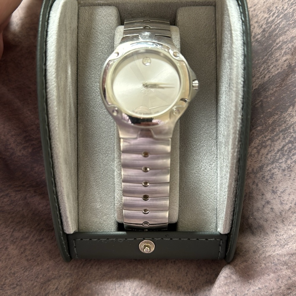 Movado SE stainless steel men’s watch. Used. In box with book and certificate.